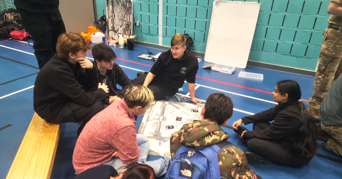 Students taking part in a planning activity looking over a map