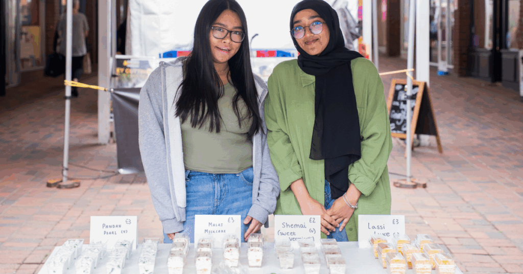 Two of our students taking part in the business fair stood at their stall