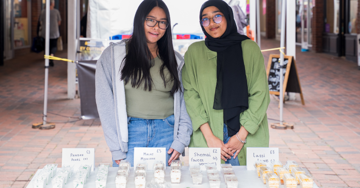 Two of our students taking part in the business fair stood at their stall